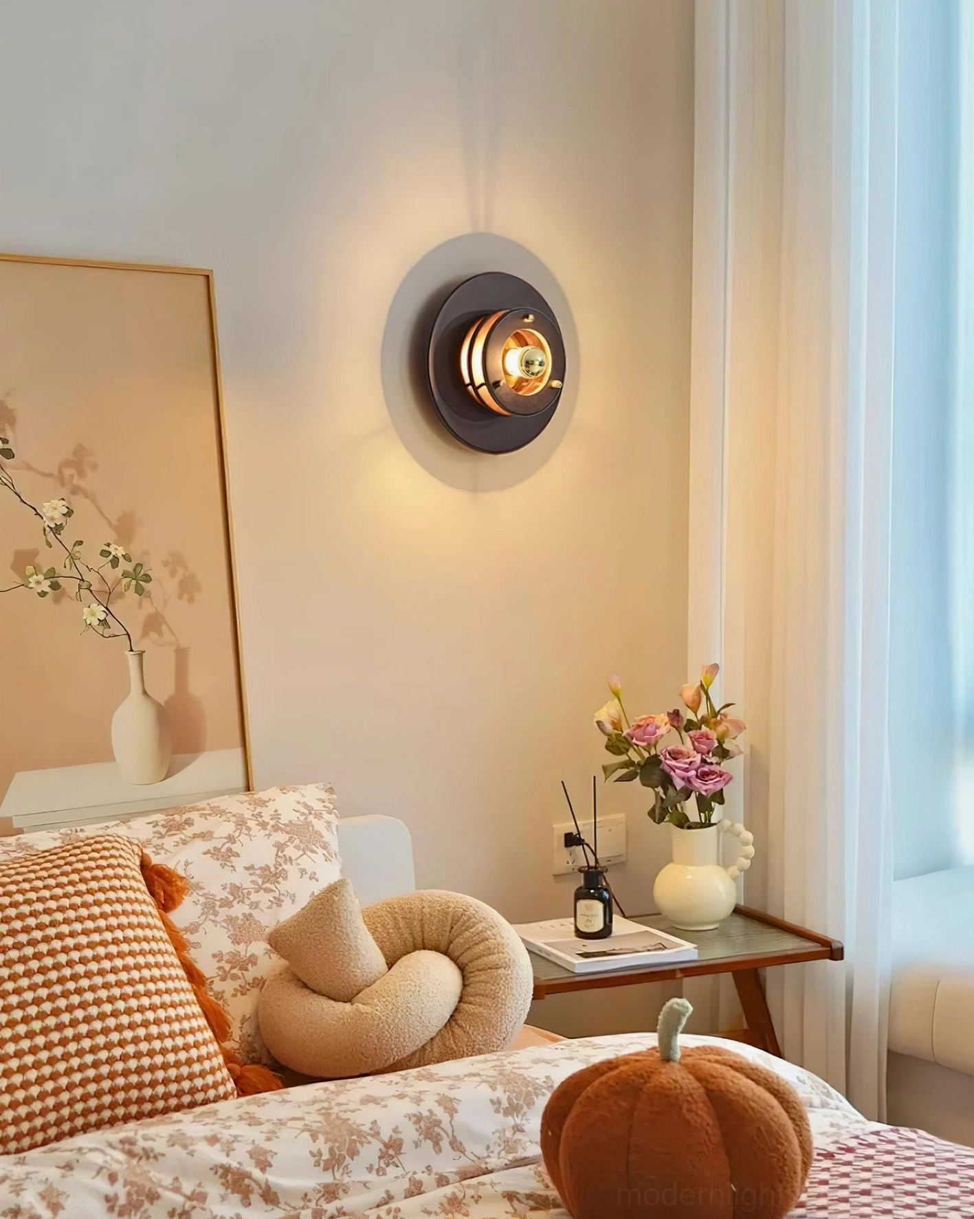 Jaima wall lamp in warmly decorated master bedroom side view matching floral textiles and home accents
