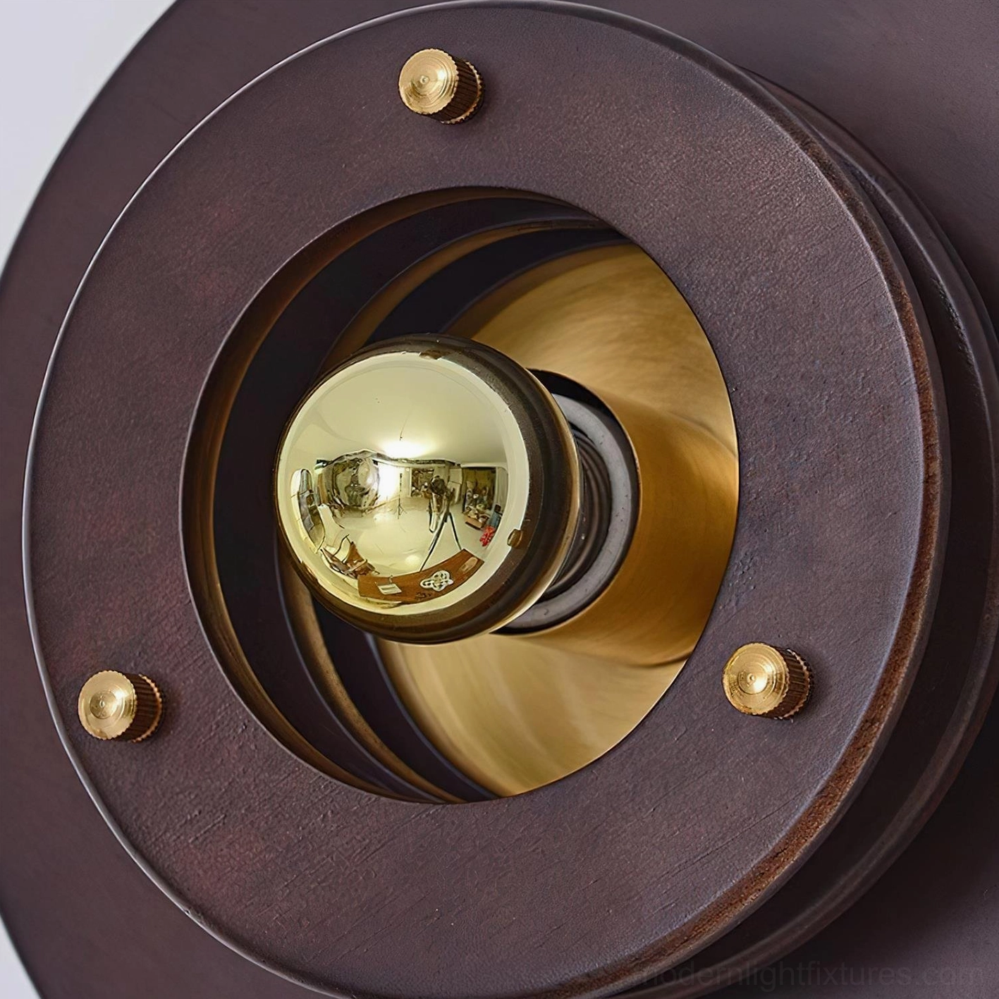 Jaima round wall lamp in walnut and gold finish showing dimensional layering and sculptural design from multiple angles