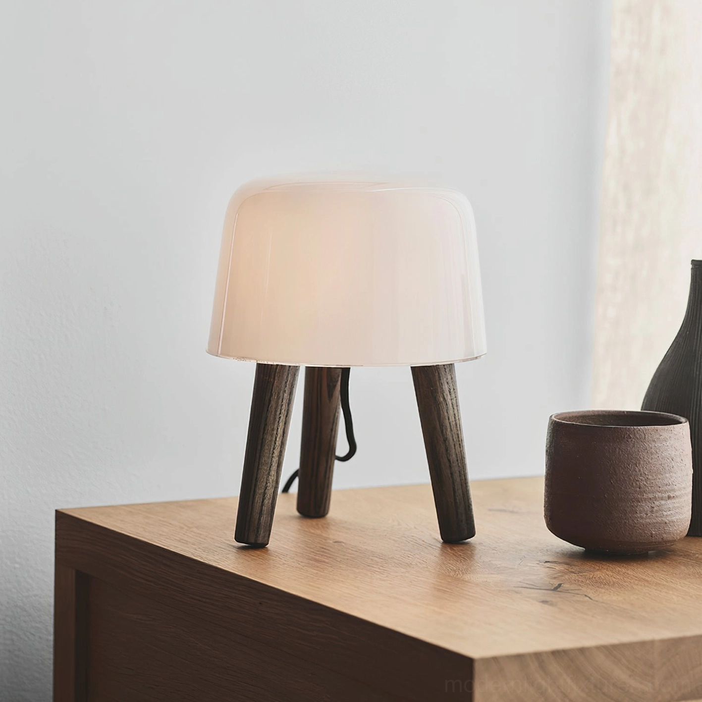 Minimalist table lamp design combining frosted milk glass with sustainable wood, ideal for Japandi and Nordic interiors