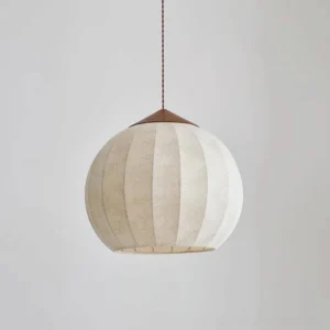 Close-up detail of ribbed fabric texture on Japandi pendant light, showcasing warm off-white tone and vertical paneling craftsmanship