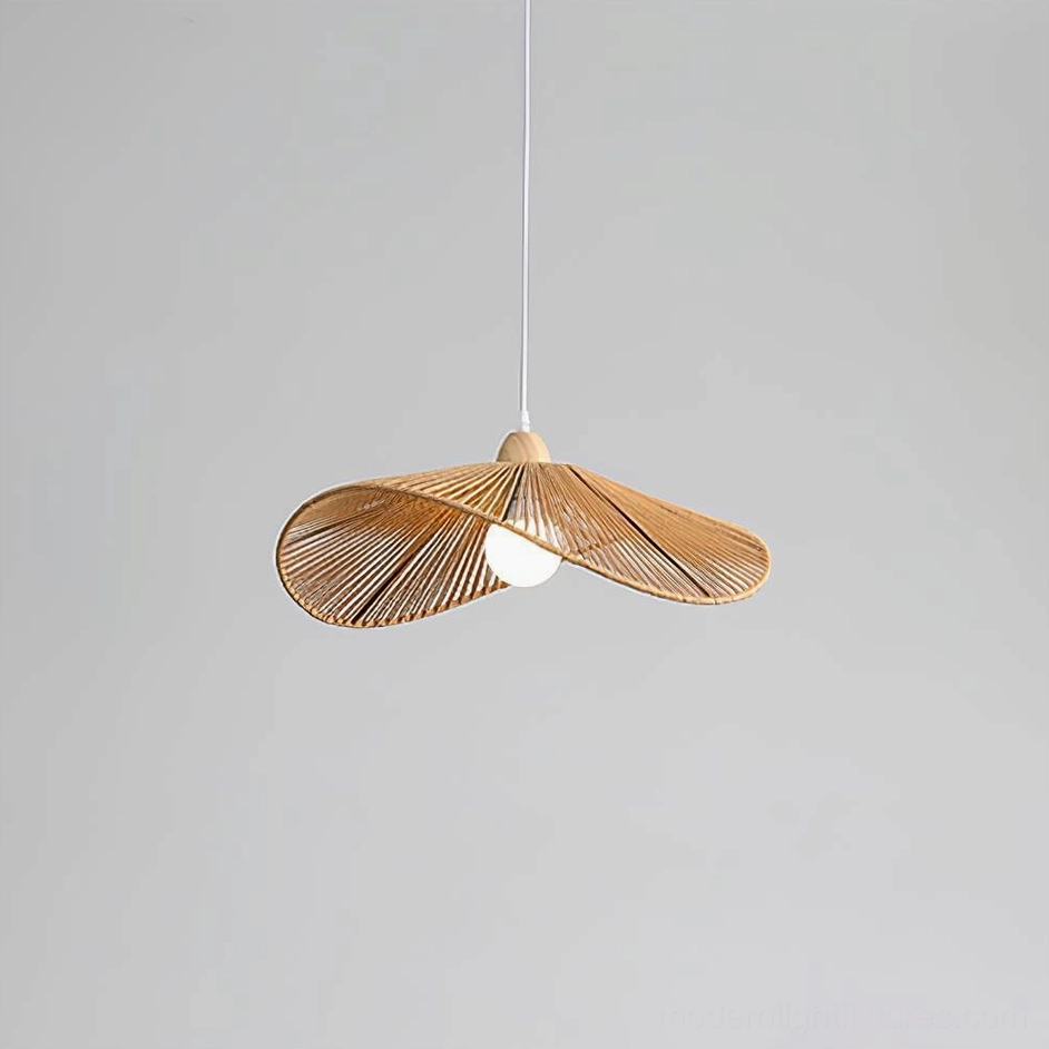 Japandi style rattan pendant light with organic petal shape and natural warm tones