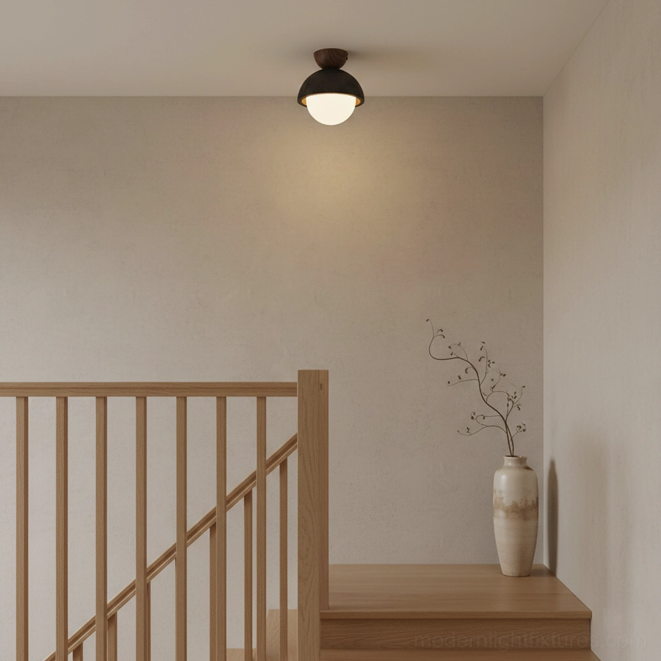 Travertine dome ceiling light in japandi stairwell with wooden railings
