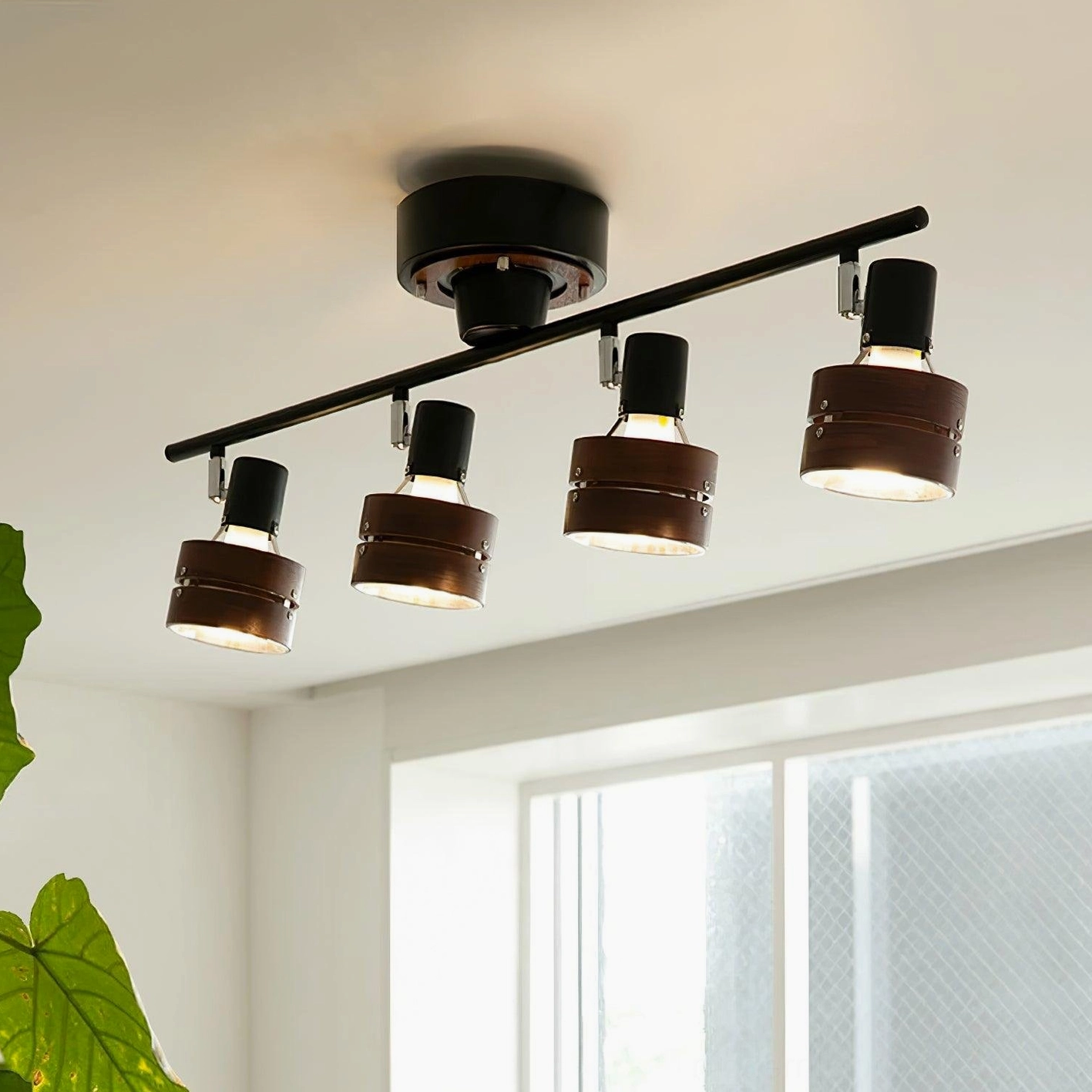 Japandi track lighting fixture demonstrating directional illumination on accent wall in contemporary home