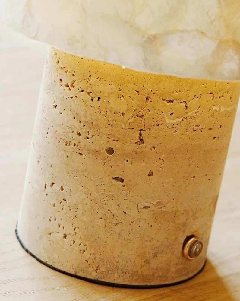 Japandi style travertine and capiz shell table lamp architectural product shot