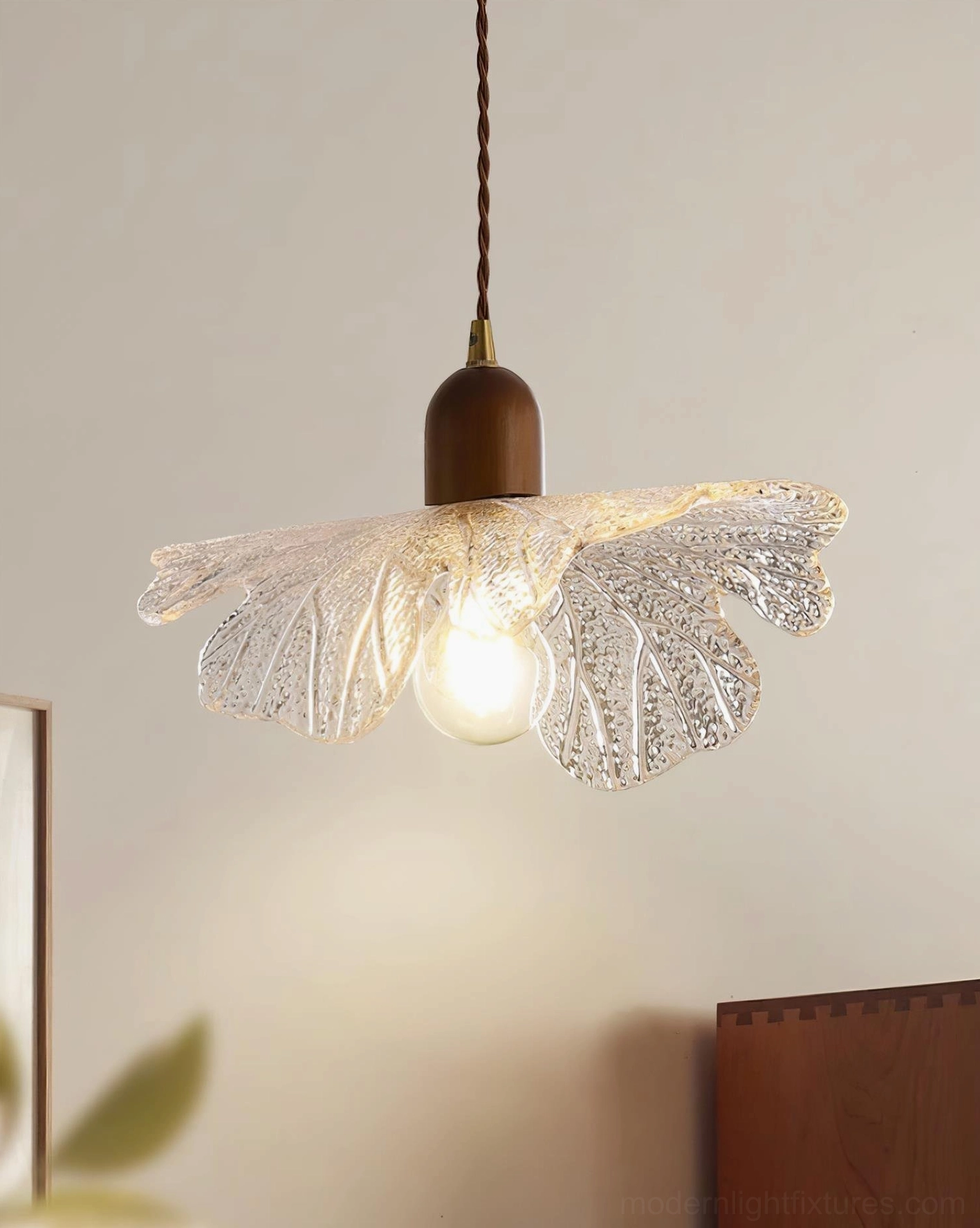Botanical glass pendant fixture demonstrating Japanese design principles in modern lighting