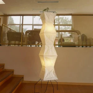 Japanese washi paper floor lamp illuminated in modern duplex loft living space, japandi interior design