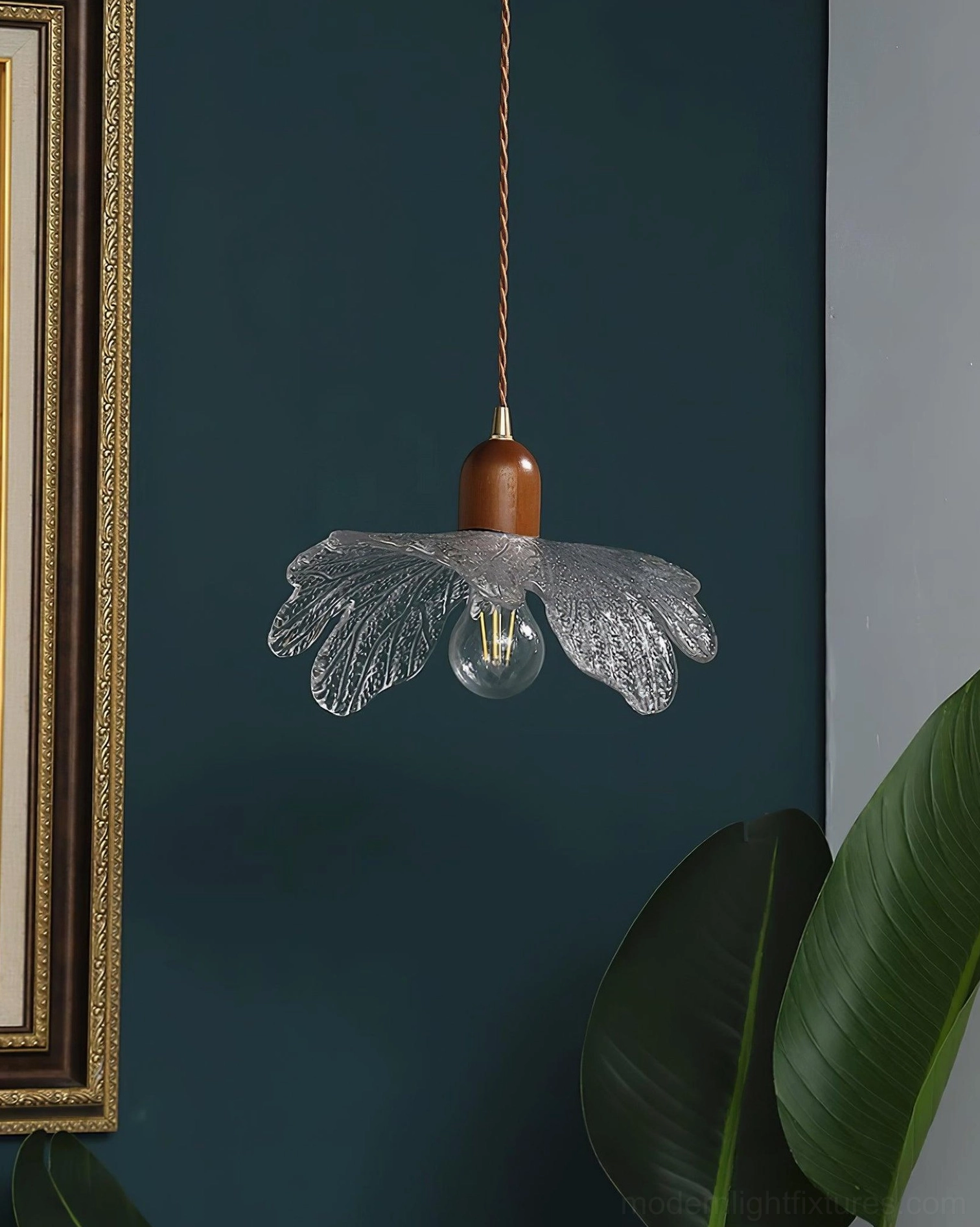 Modern petal glass pendant light with unlit bulb, minimalist design aesthetic