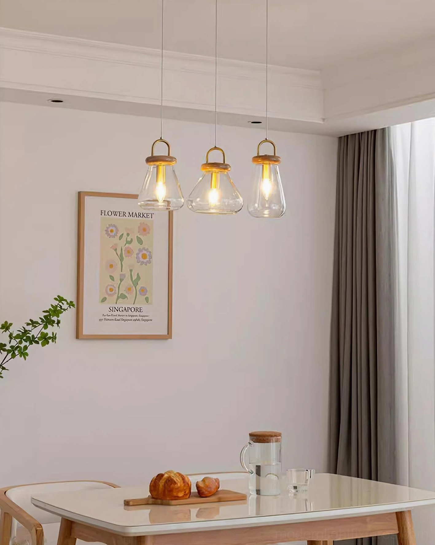 Jar pendant lights above wooden dining table in modern farmhouse dining area with warm ambiance