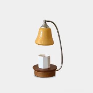 Jaren halogen candle warmer lamp with yellow amber glass shade and chrome metal arm, front studio view