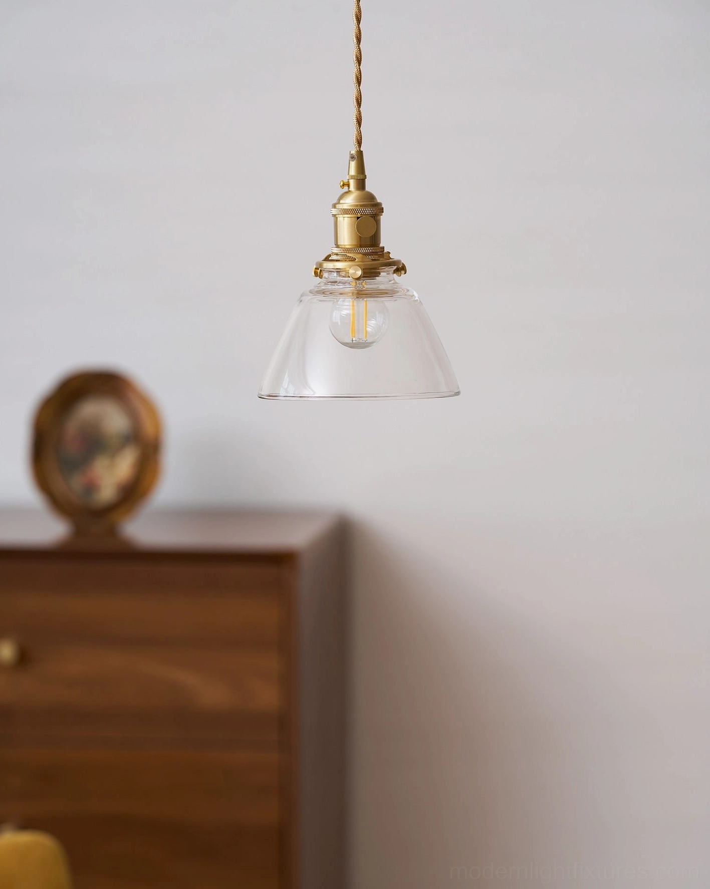 Jasmine glass pendant installed in contemporary home interior above accent table modern lighting
