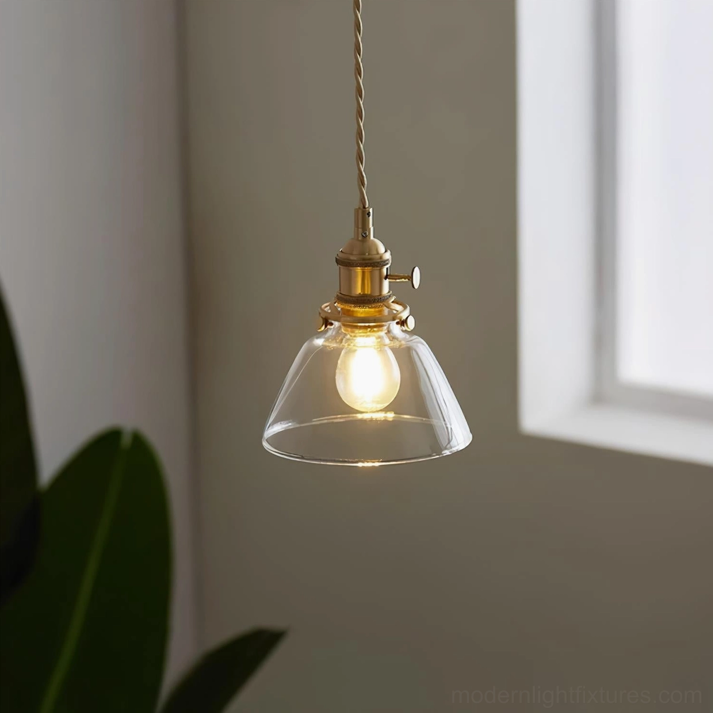 Jasmine glass pendant light collection featuring clear dome, globe, and fluted models with brass fixtures