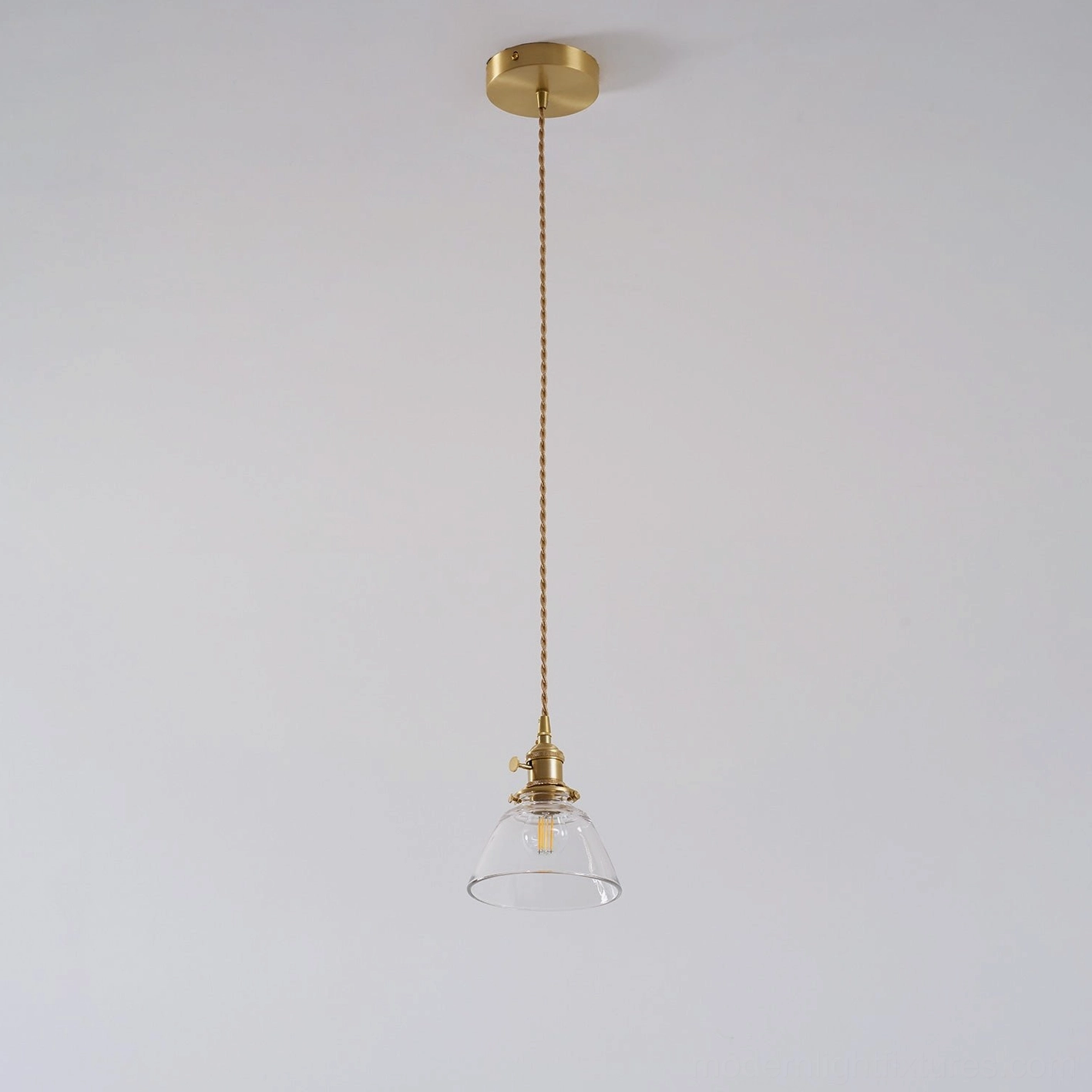 Jasmine pendant lights above kitchen counter workspace showing proportional compact sizing and brass detail