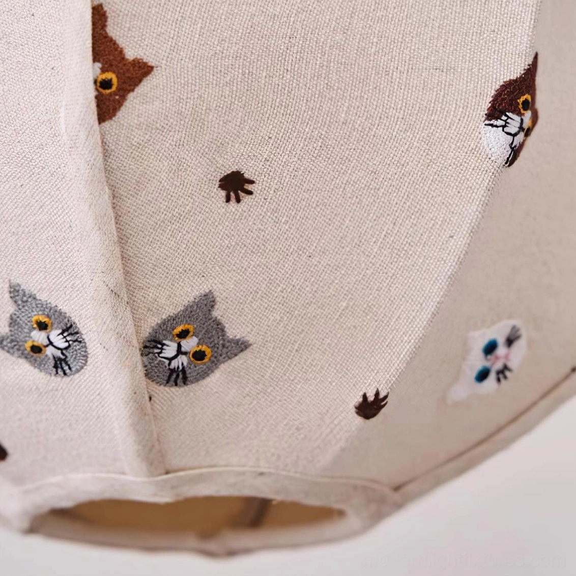 Jayne fabric pendant light showing cartoon animal illustrations and warm light diffusion through linen texture