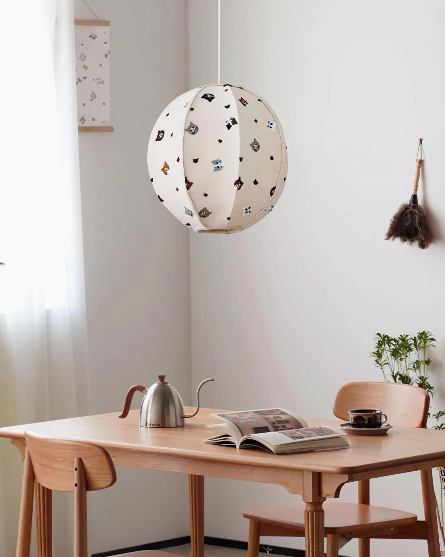 Jayne cat pendant light suspended in Japanese-style dining area with wooden table, cozy minimalist ambiance