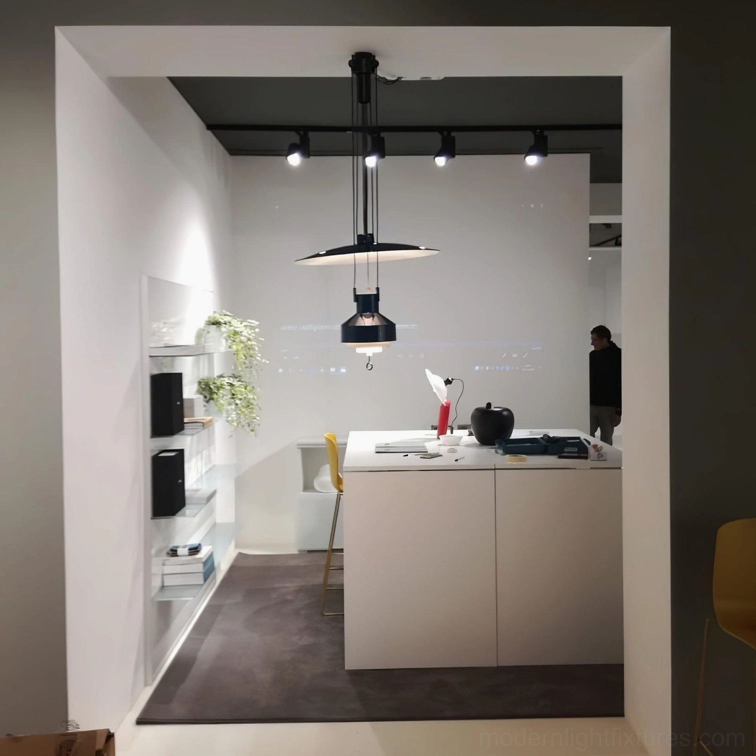 Black track-mounted jeka pendant lights in modern office kitchenette