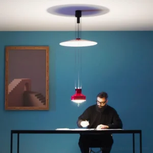 Dual red and white modern pendant lamps in Scandinavian study workspace