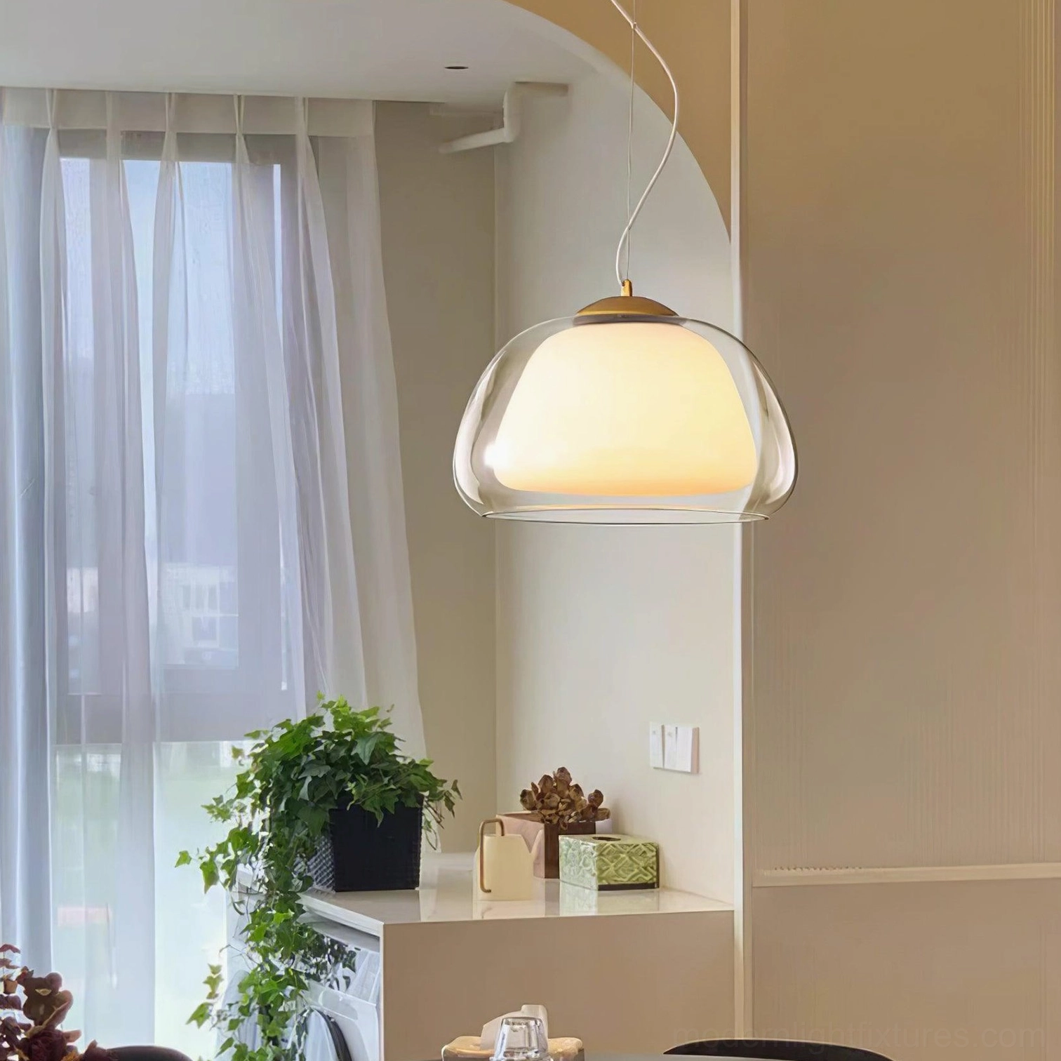 Elegant double-layer glass pendant light showing smooth dome silhouette against neutral background