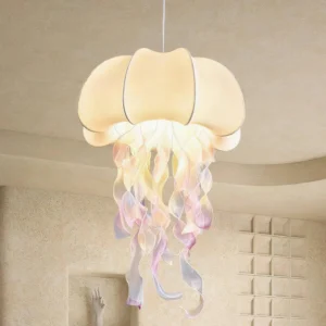 Close-up detail of jellyfish hanging lamp showing stitched fabric shade and flowing iridescent gradient tassels with warm glow
