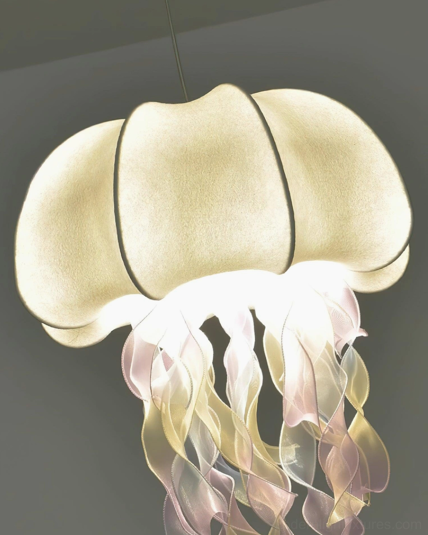 Jellyfish fabric pendant lamp showing side profile with dome and tassel silhouette