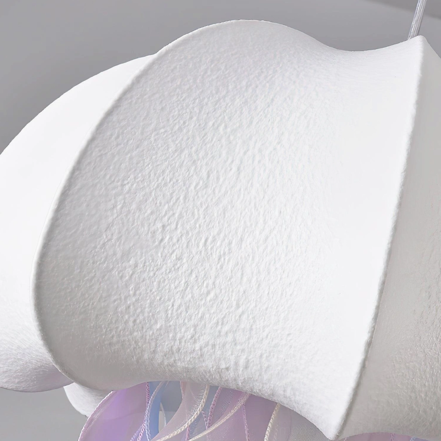 Jellyfish fabric pendant light creating warm oceanic ambiance in contemporary home setting
