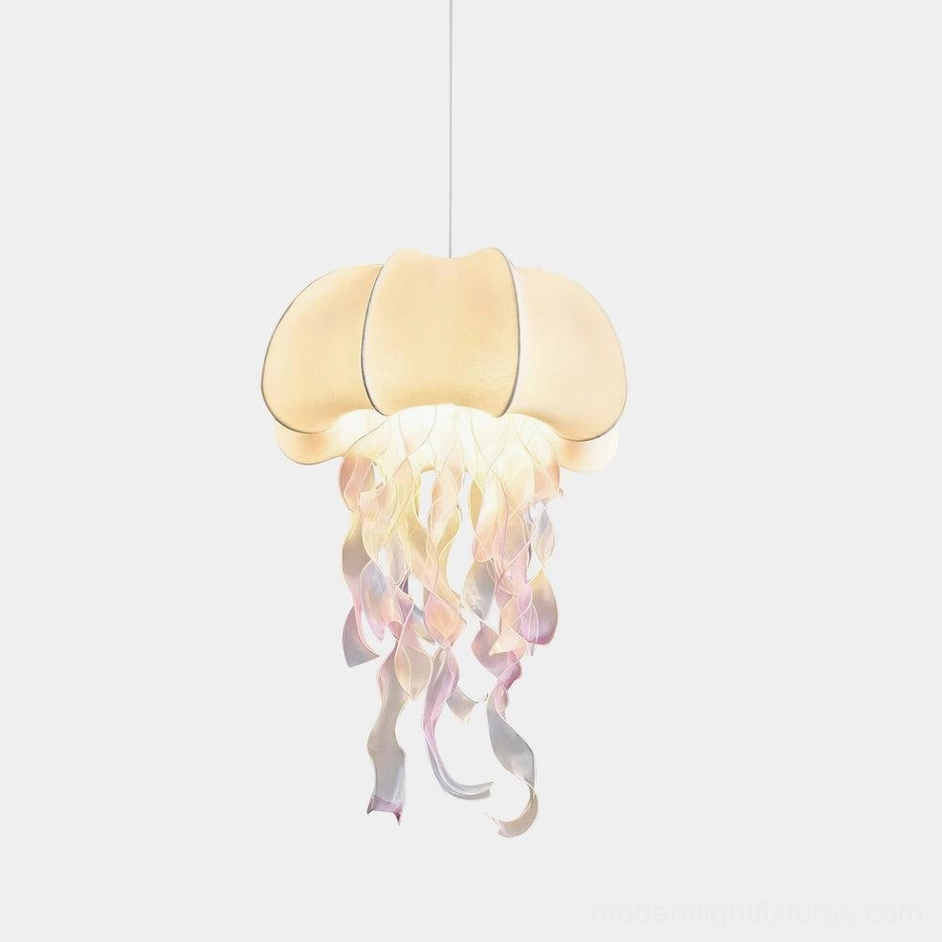 Jellyfish fabric pendant light with creamy white dome and pink-purple gradient tentacle tassels, front studio view