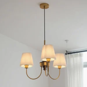 Jeremiah pendant light fixture illuminated in residential living room with sheer curtains and warm ambient lighting