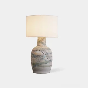 Jordyn ceramic table lamp with hand-embossed dot texture, off-white fabric shade, and watercolor glazed base on white background