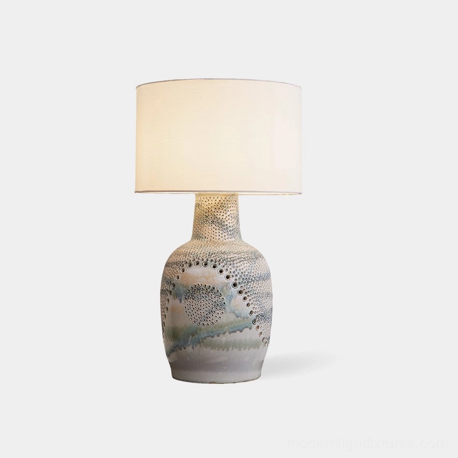 Jordyn ceramic table lamp with hand-embossed dot texture, off-white fabric shade, and watercolor glazed base on white background