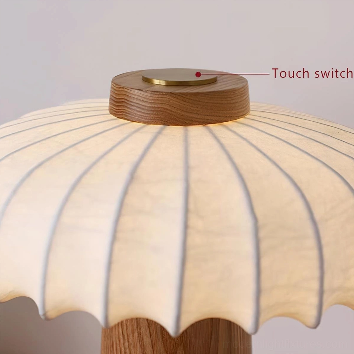 Juego mushroom table lamp close-up detail showing pleated fabric shade texture and touch switch