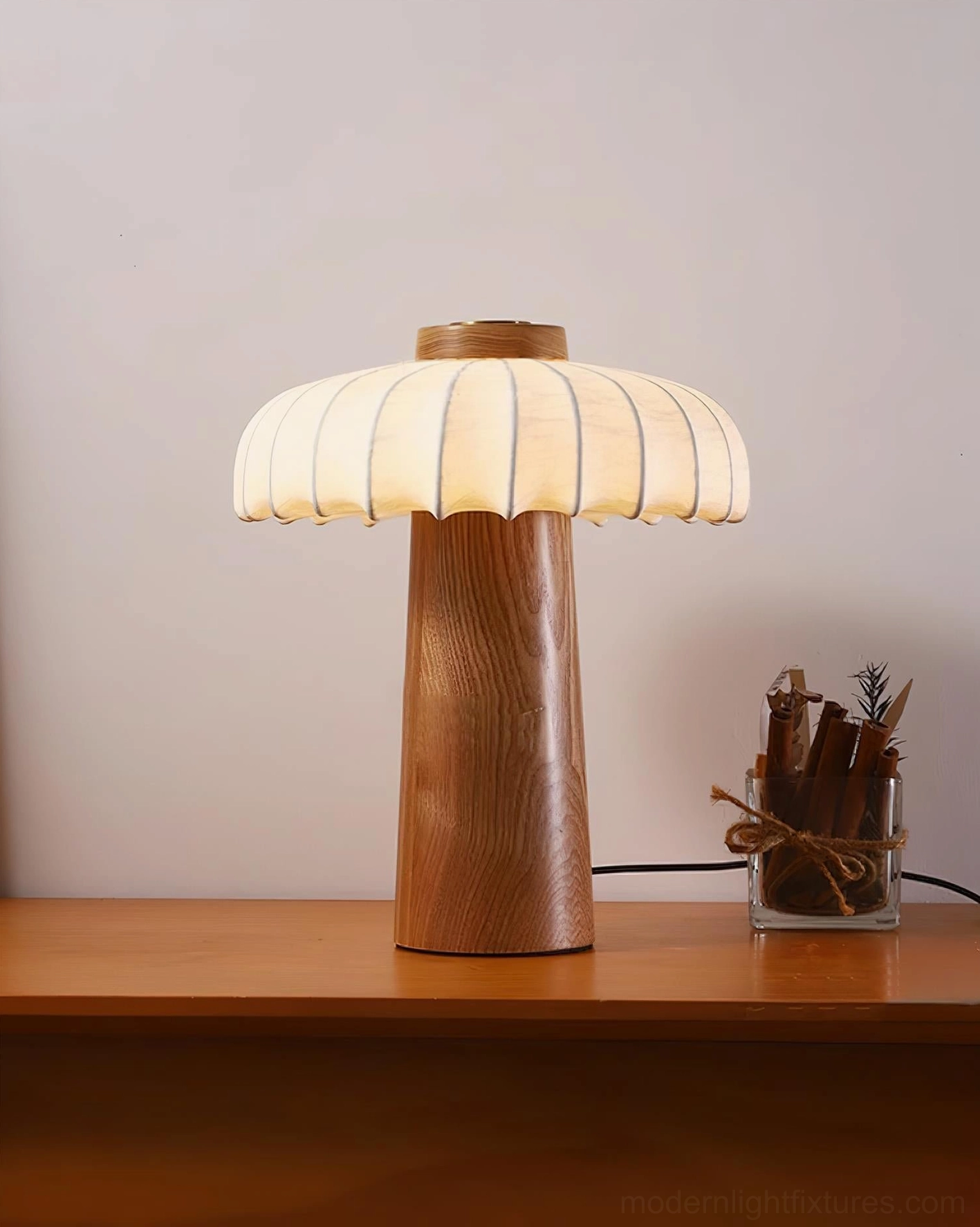 Juego wooden table lamp with warm ambient lighting in contemporary bedroom setting
