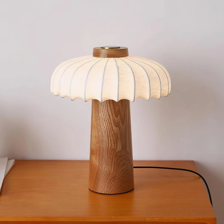 Juego wooden mushroom table lamp with natural wood color finish and ribbed fabric shade