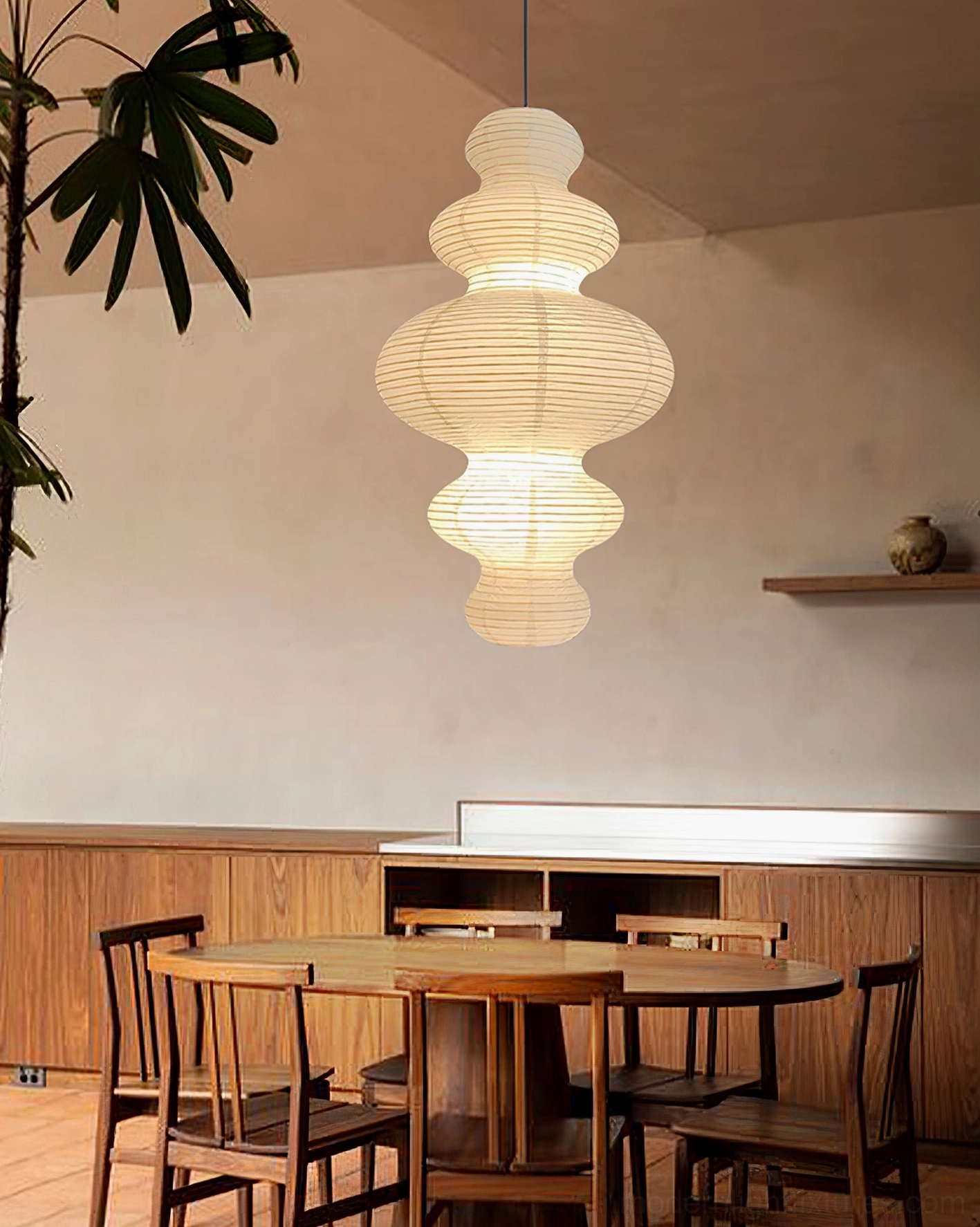 Juni pendant lamp creating diffused warm light in minimalist bedroom space
