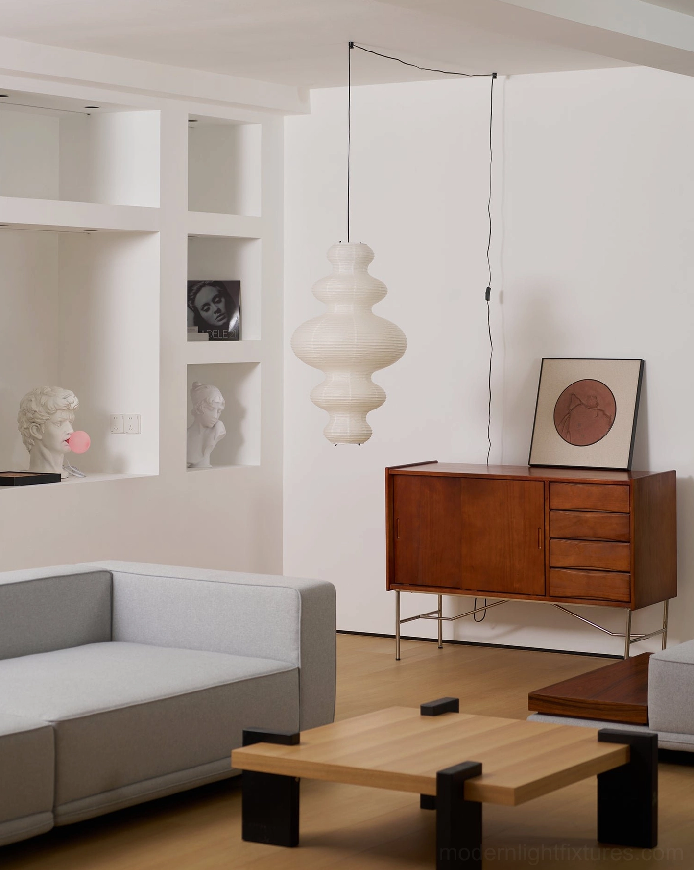 Juni plug-in pendant light installed in contemporary home interior - warm glow