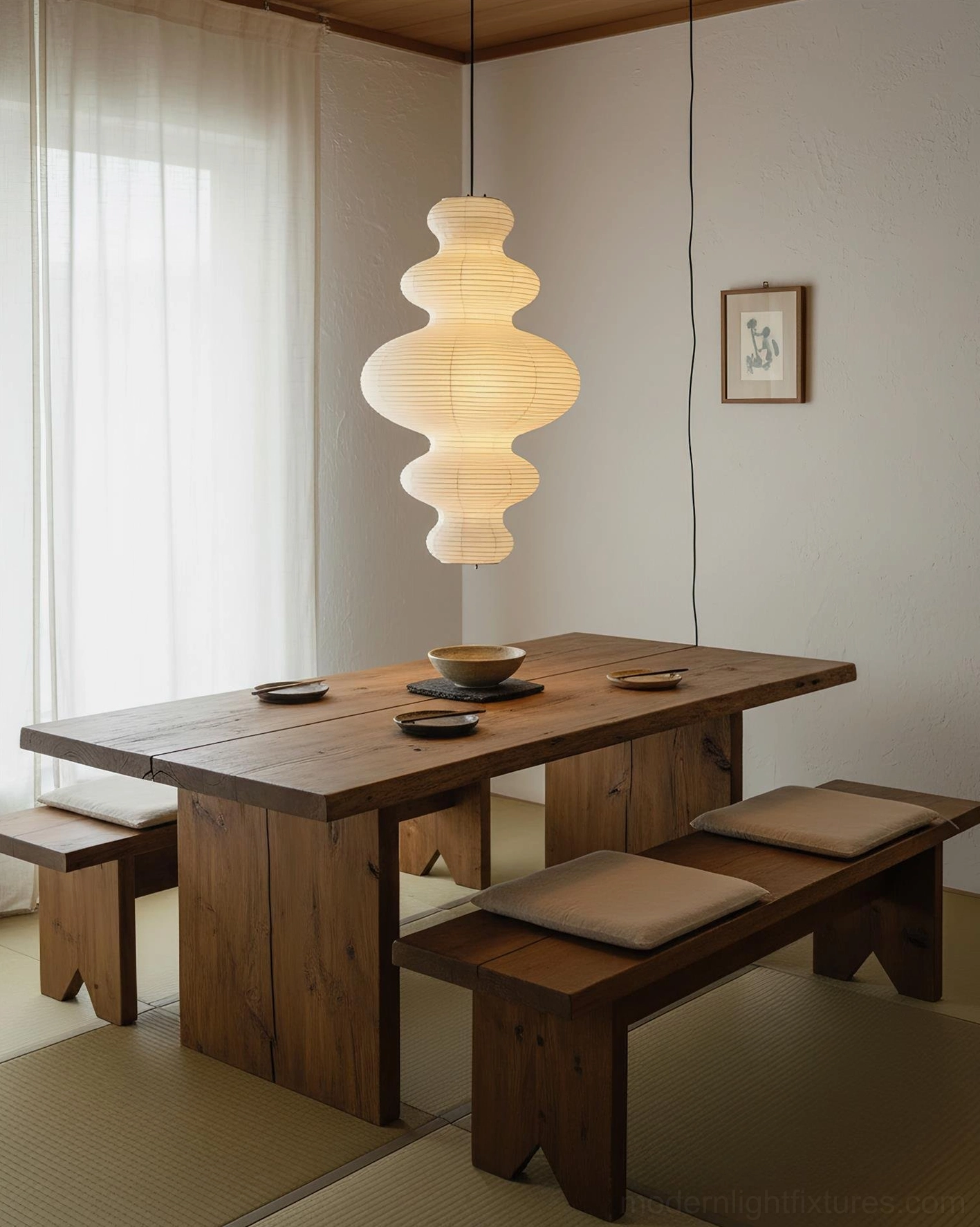Juni pendant lamp full view in minimalist room setting with warm atmospheric lighting
