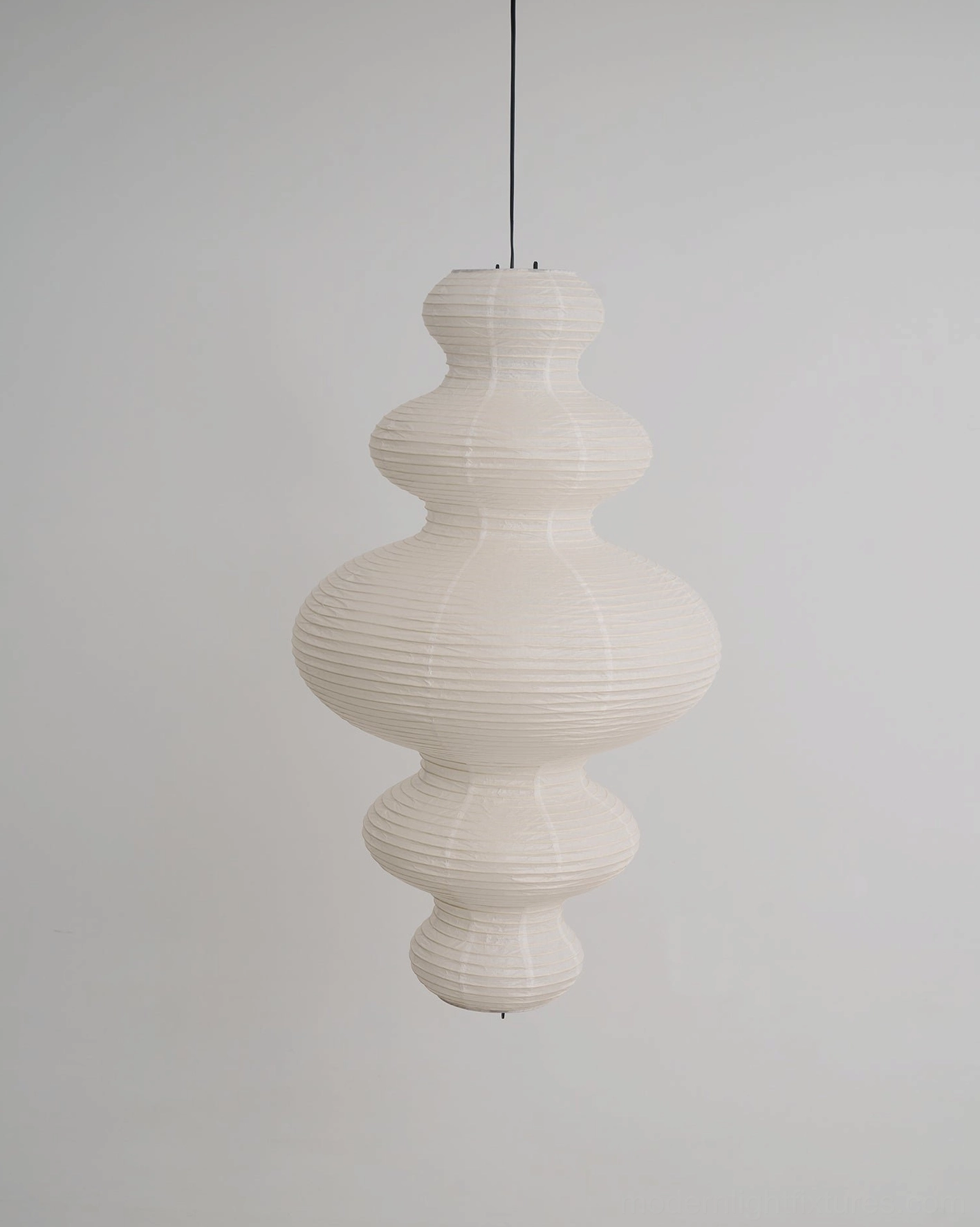 Juni paper pendant lamp - modern sculptural form with traditional craft materials