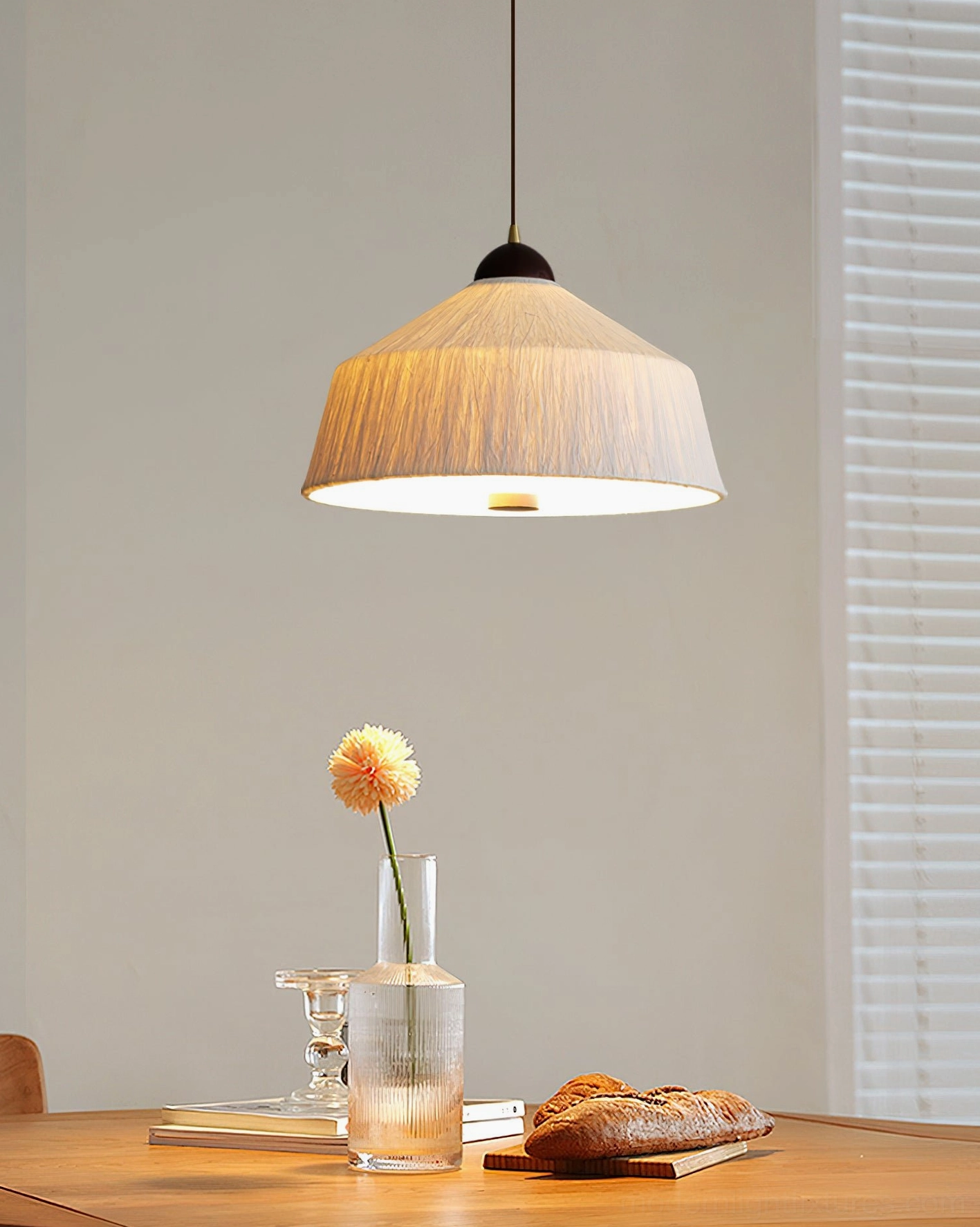 Jute colored Doria pendant light, natural fiber aesthetic with warm wood grain top cap