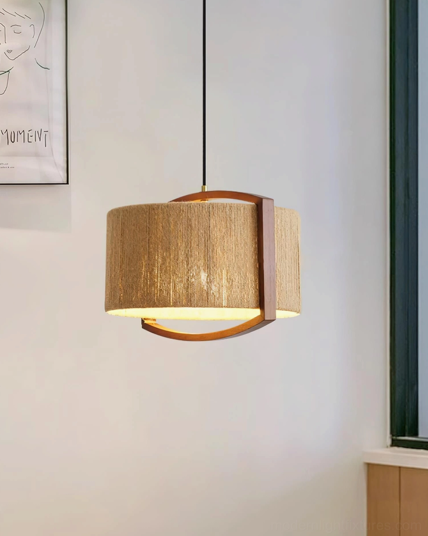 Woven cotton jute pendant fixture with walnut frame in living room, front view with green window and wall art