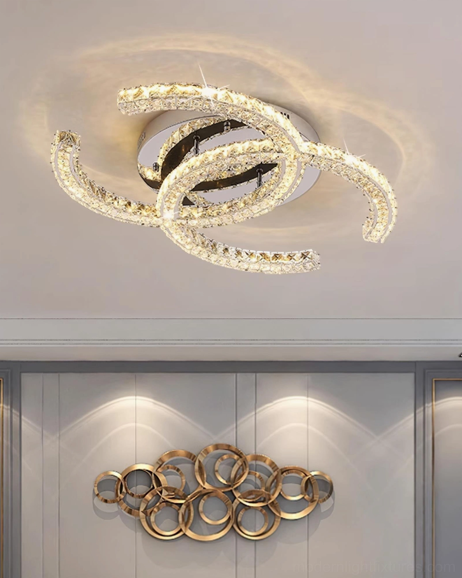 Close-up detail of K9 optical crystal array on polished stainless steel ceiling light frame
