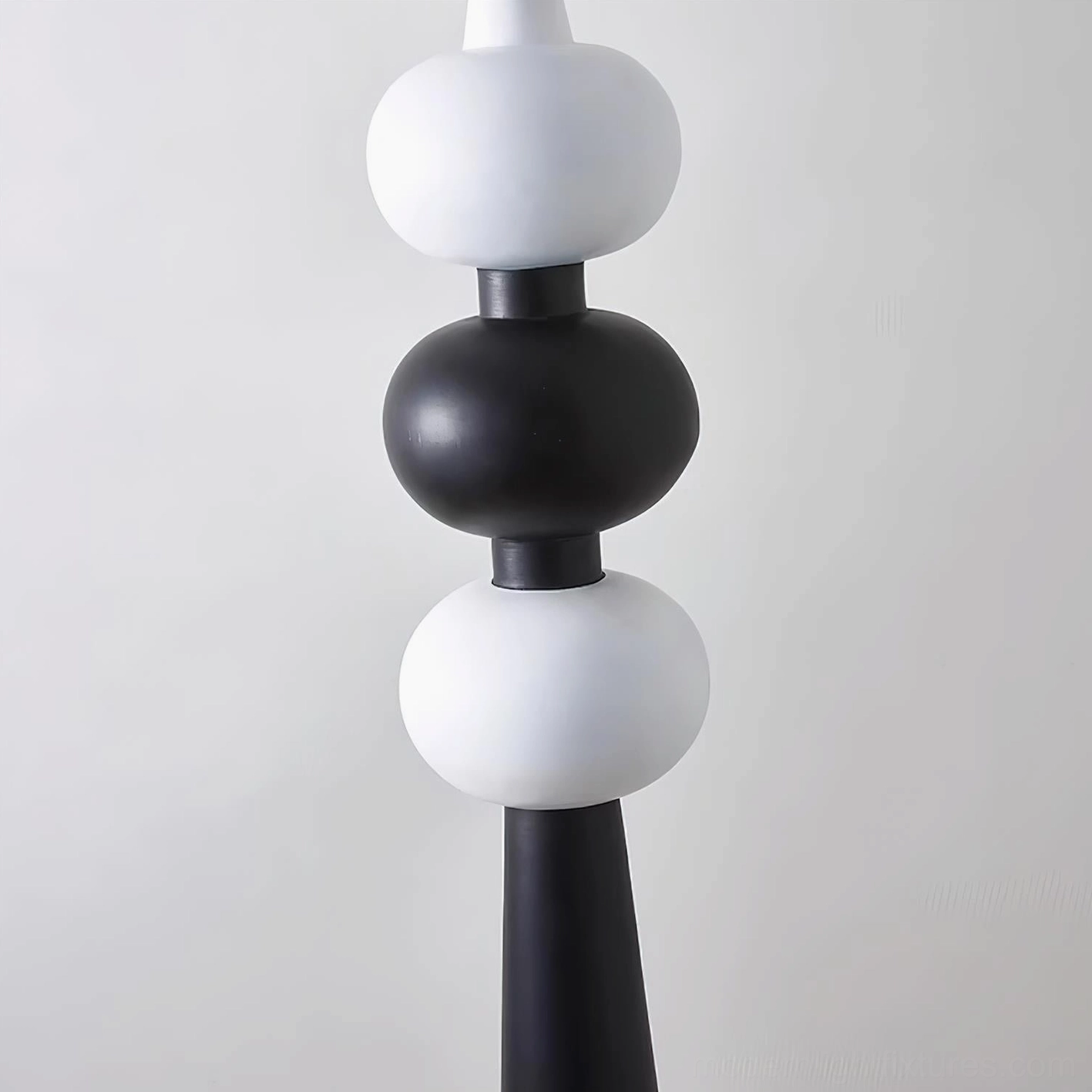 Contemporary Kabin floor lamp with artistic stacked sphere composition and frosted diffuser globe, modern home accent