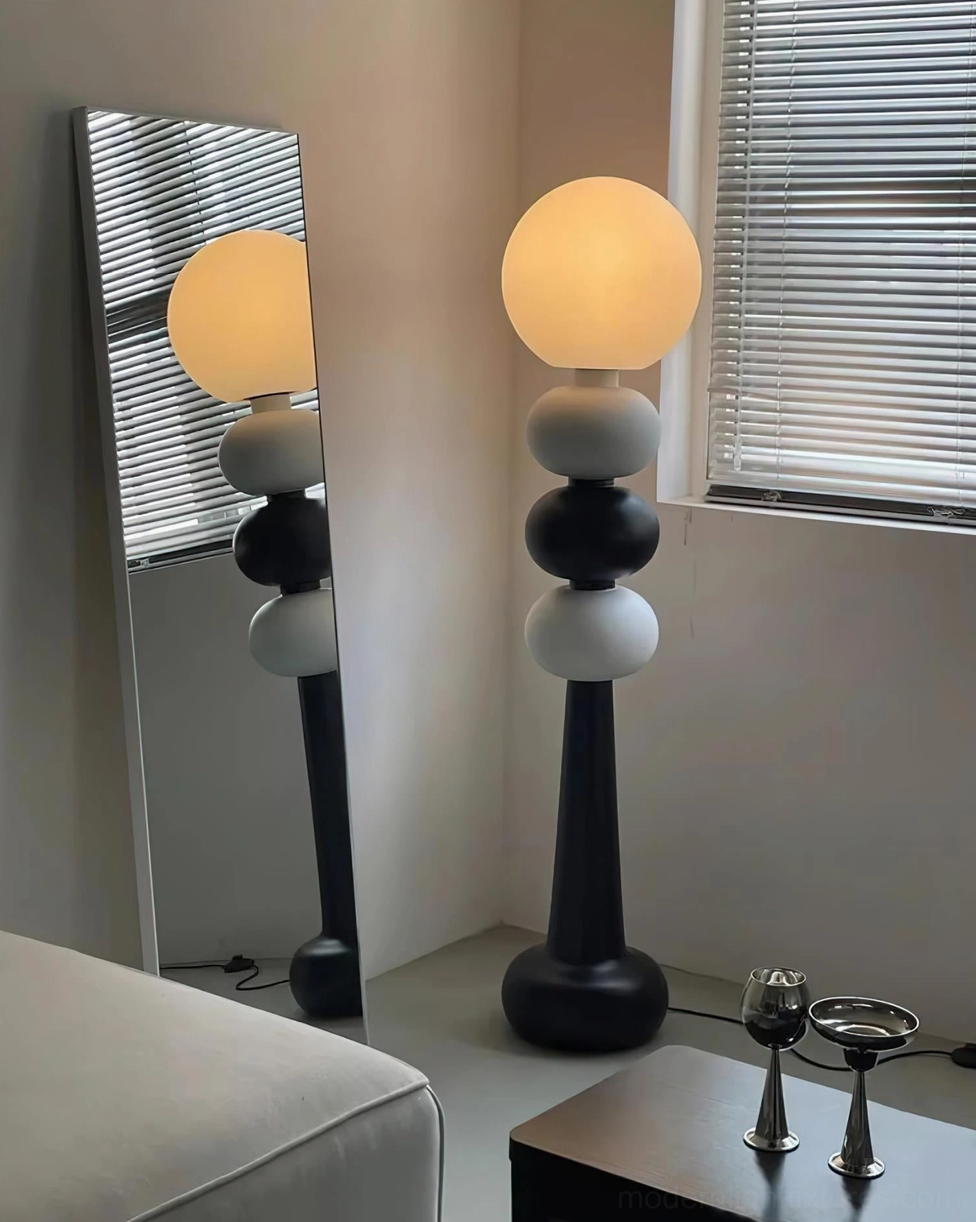 Modern stacked sphere floor lamp, Kabin design with black and white geometric construction and frosted light diffuser