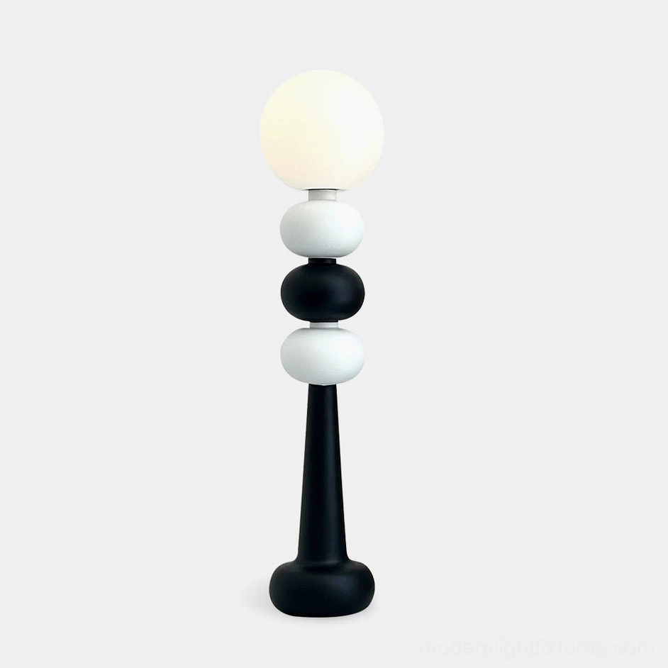 Kabin modern geometric floor lamp with stacked black and white spheres, frosted acrylic globe shade, studio isolated view