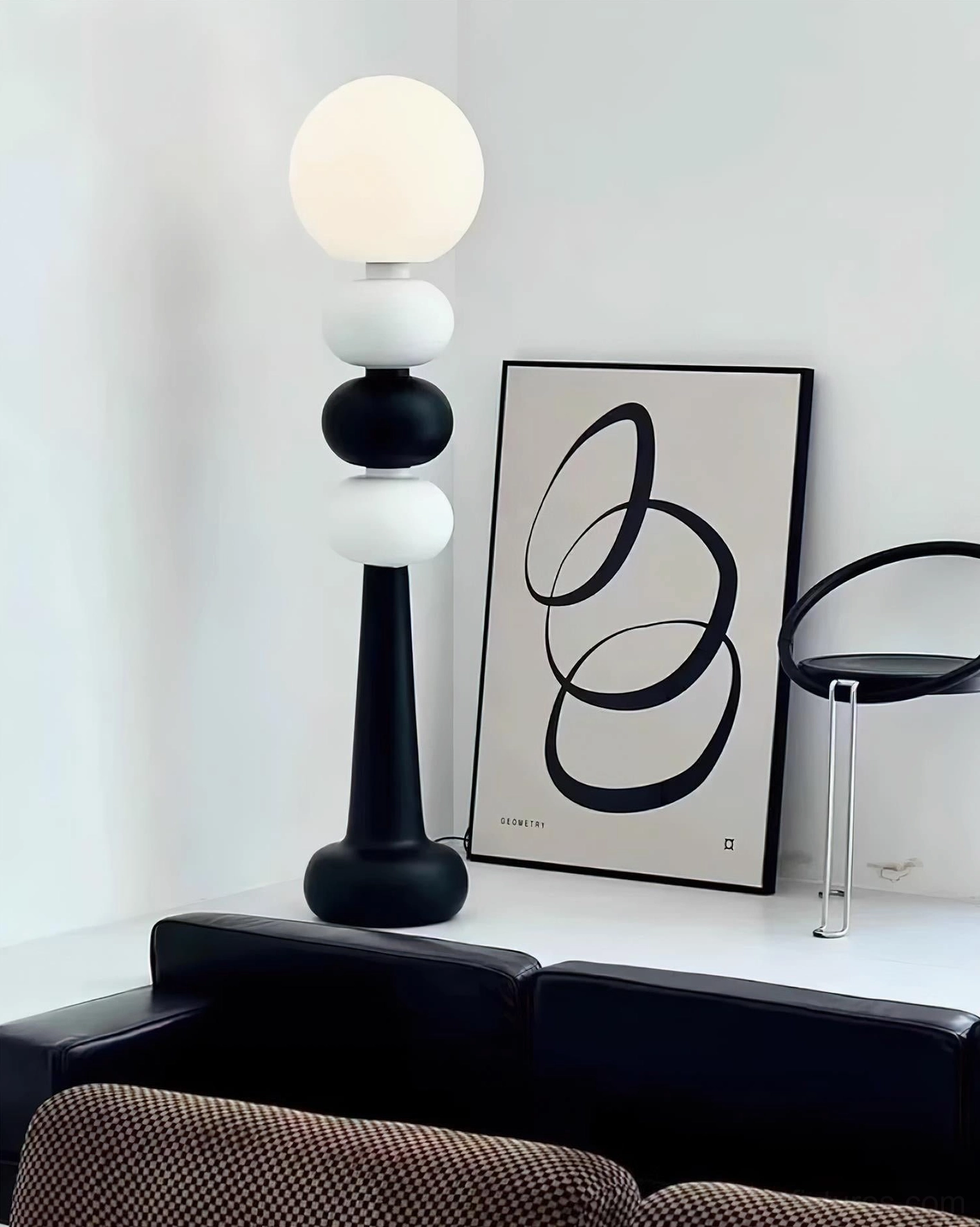Kabin minimalist floor lamp featuring stacked black and white spheres with acrylic frosted globe for modern home decor
