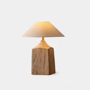 Kadoka natural wood table lamp with fabric shade, front studio view showing solid wood base and tapered linen lampshade