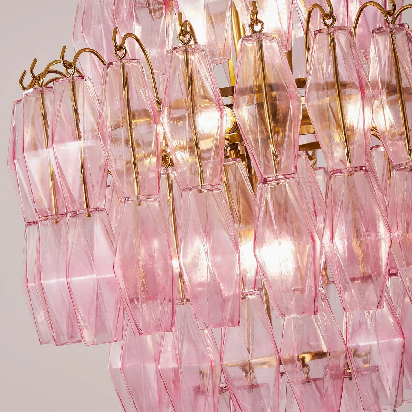 Kaelis modern tiered glass chandelier, metal frame detail showing structural design and finish