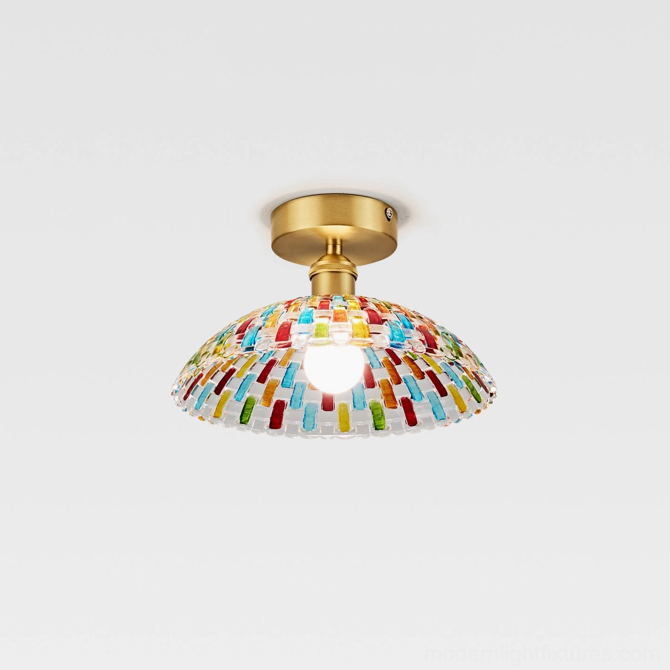 Kaleido glass ceiling light fixture detail view, showing multicolor hand-cut glass mosaic dome and brass canopy installation