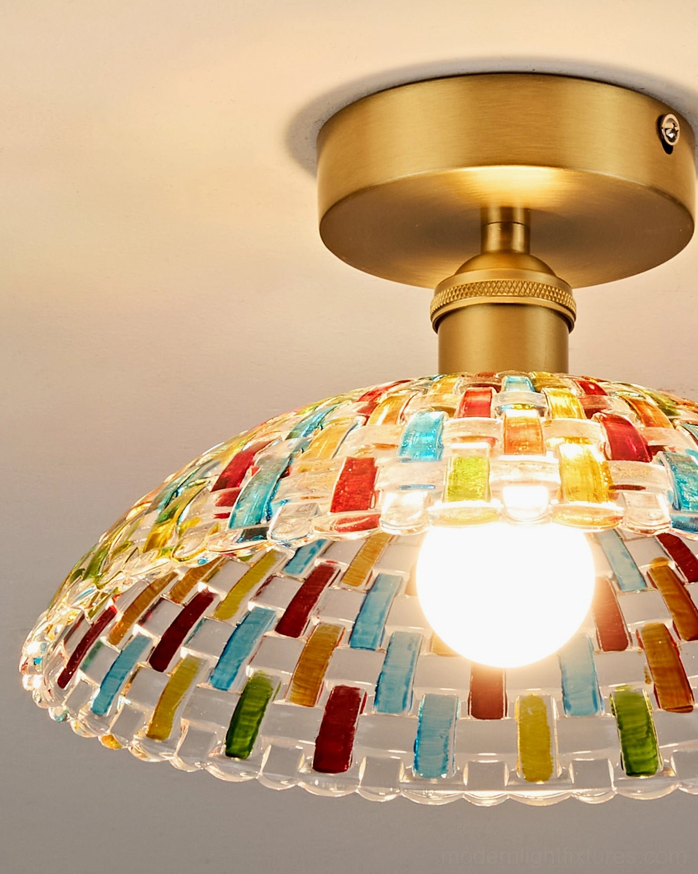 Kaleido mosaic ceiling light fixture with hand-cut glass dome and brass mount, artistic kaleidoscopic light refraction design