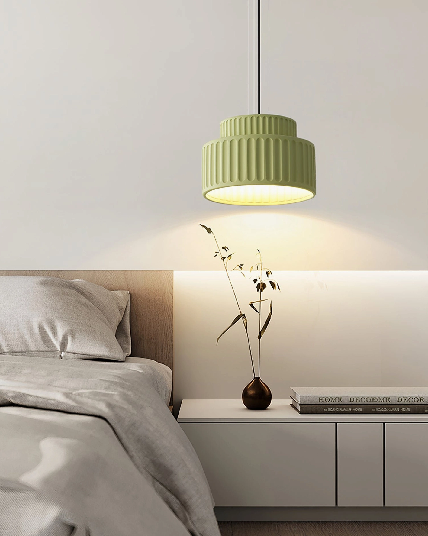 Sage green Kami ribbed pendant light in master bedroom, front hanging view with compact layered design
