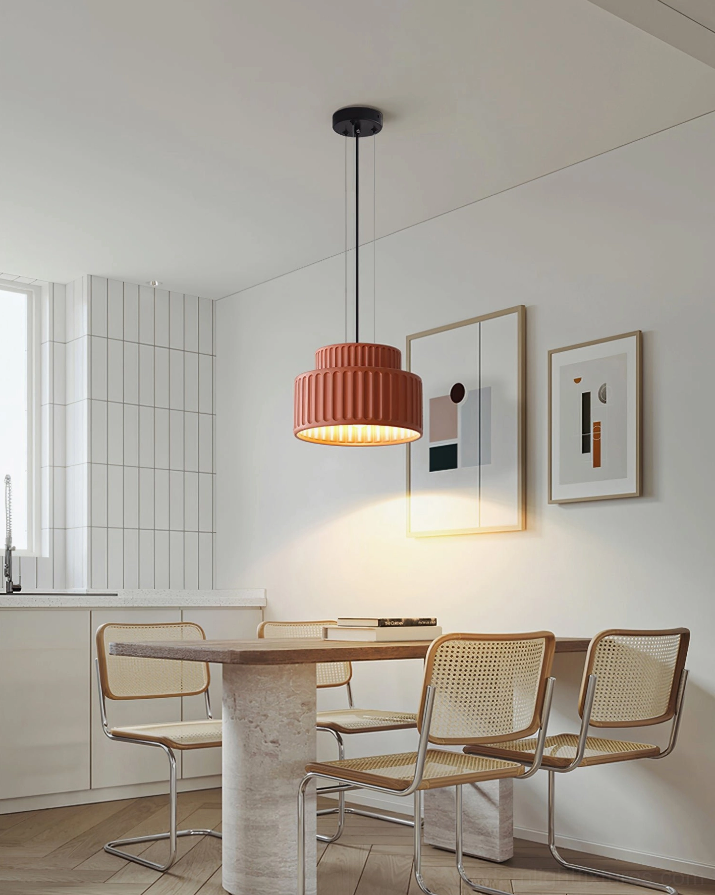 Terracotta Kami pleated pendant suspended over contemporary dining table, overhead view in apartment dining space