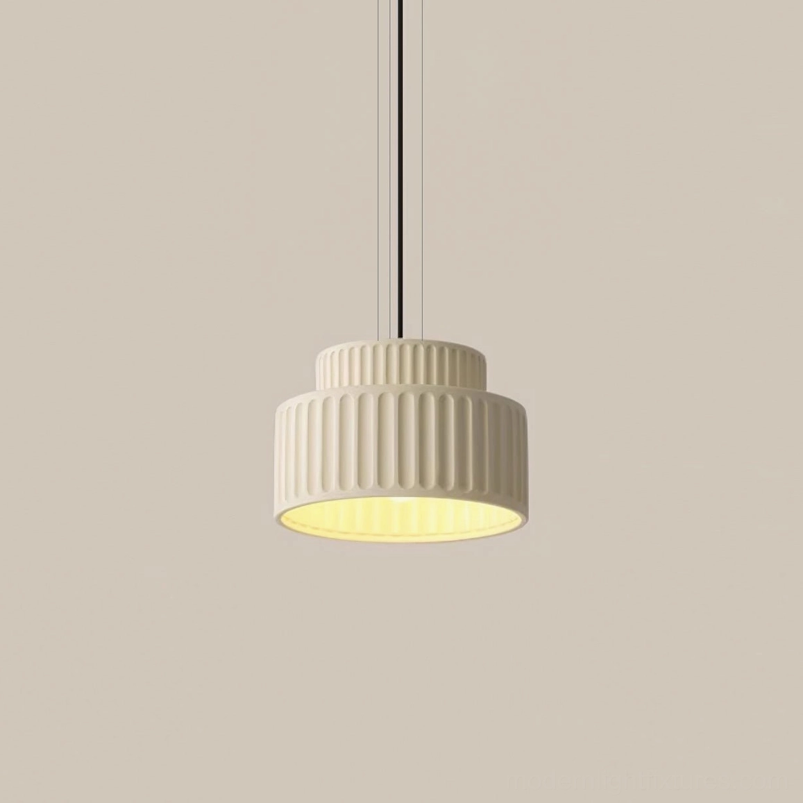 Beige Kami pendant lamp with tiered cylindrical design, soft neutral tone for contemporary interiors