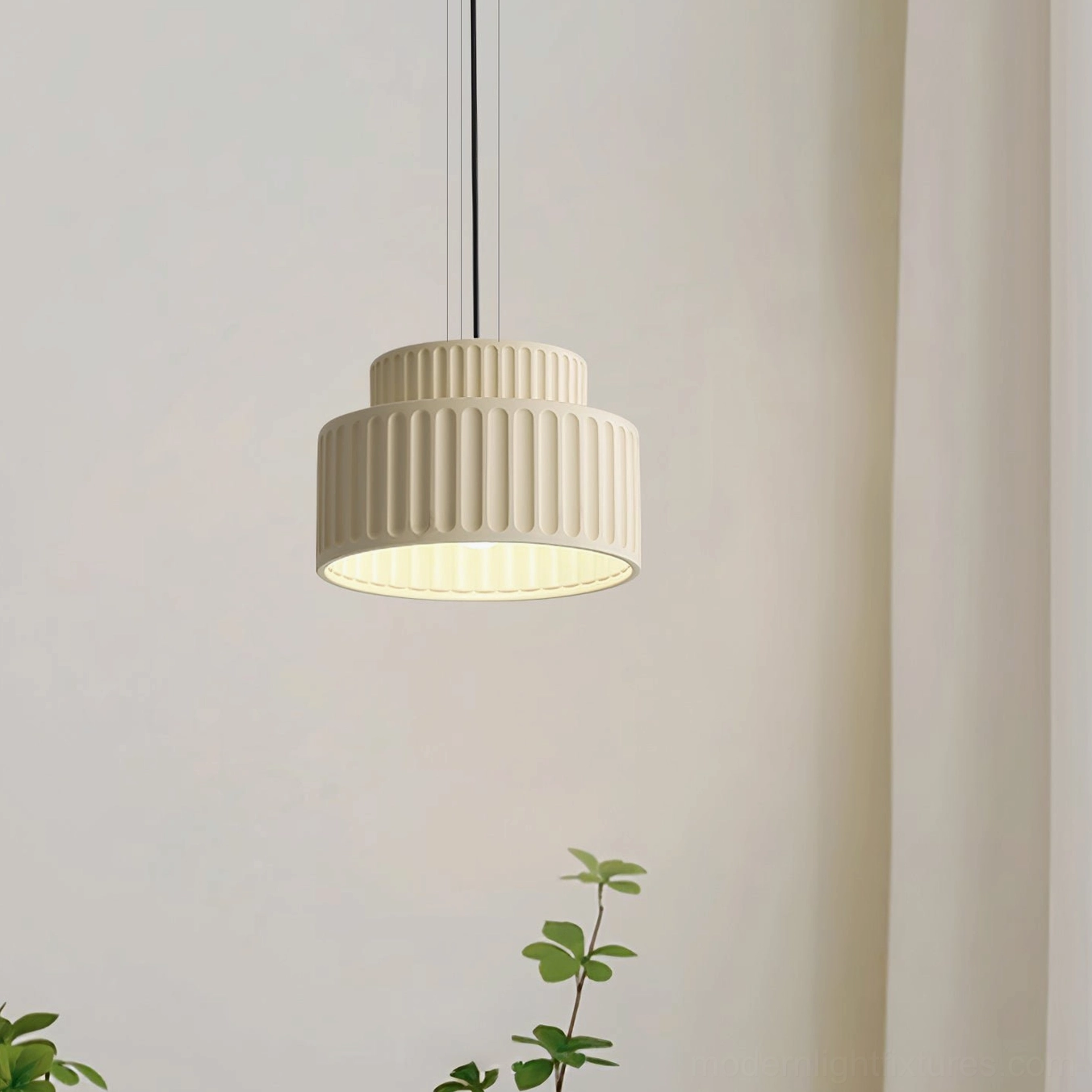 Cream white Kami ribbed pendant light, bottom-up view in minimalist interior setting with soft warm glow